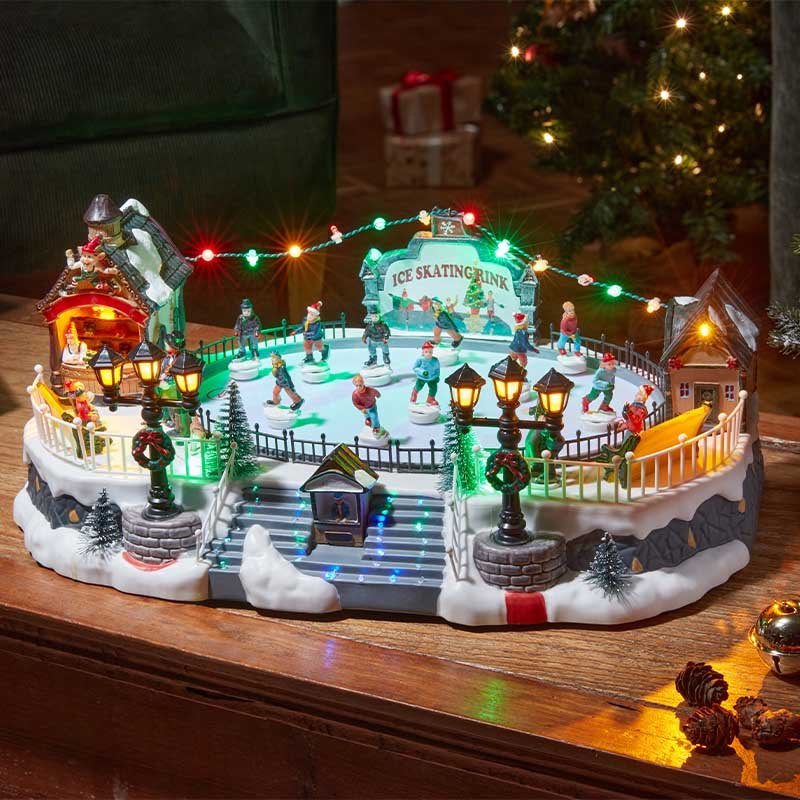 Merry Skaters! Large Animated Musical LED Ice Rink Snow Scene – 17cm x 40cm - XMAS CERAMIC WOOD RESIN GLASS ORNAMENTS - Beattys of Loughrea