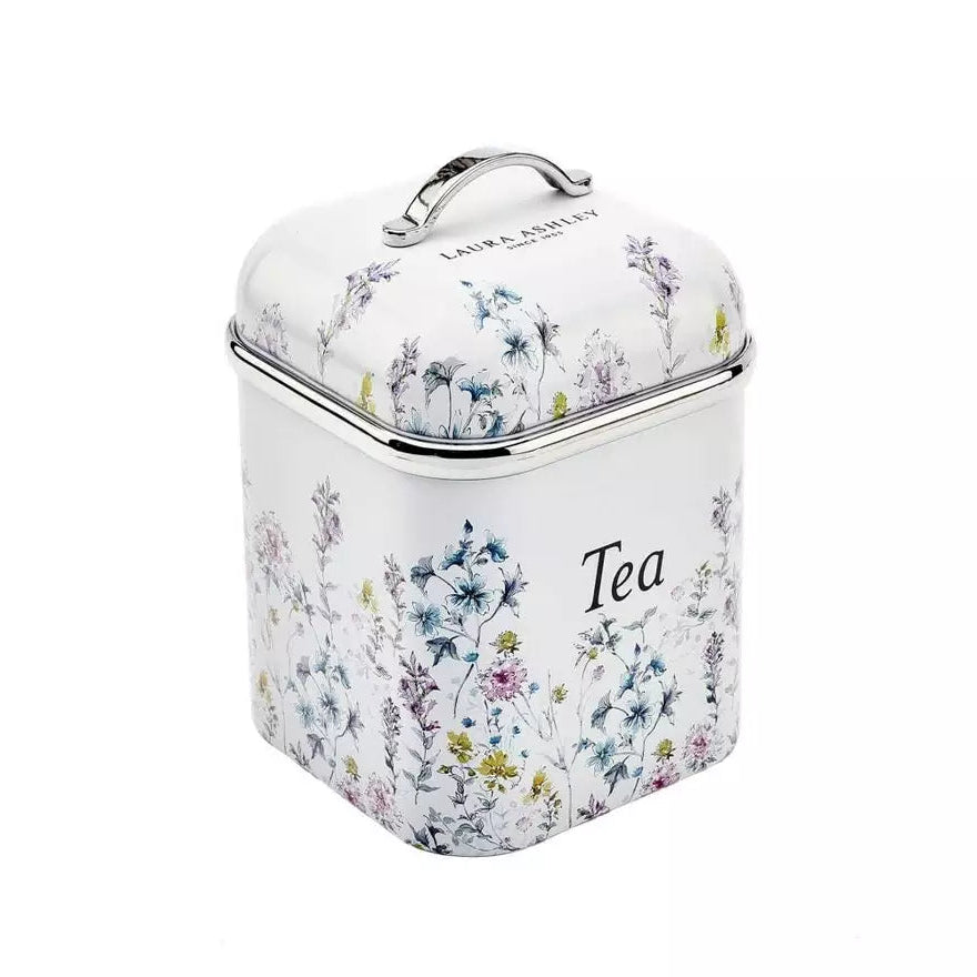 A square white tea canister with a floral print, featuring a silver metal handle and rim, and the words 'LAIN & LEISLEY' and 'Tea' printed on it, set against a plain white background.