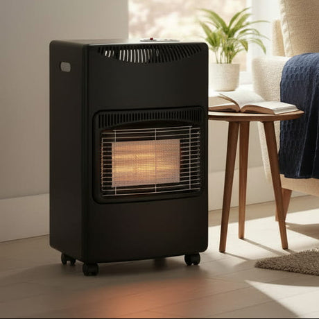 Woman sitting on a couch in a living room with a portable space heater.