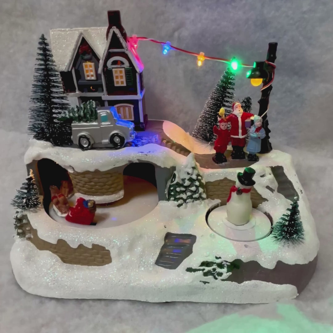 Noma Santa & Snowman Village Scene – 17cm